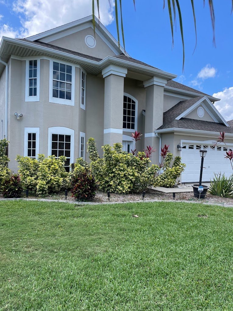 Two-story Florida home after professional house washing in Brevard and Volusia County by Suncoast Softwash.