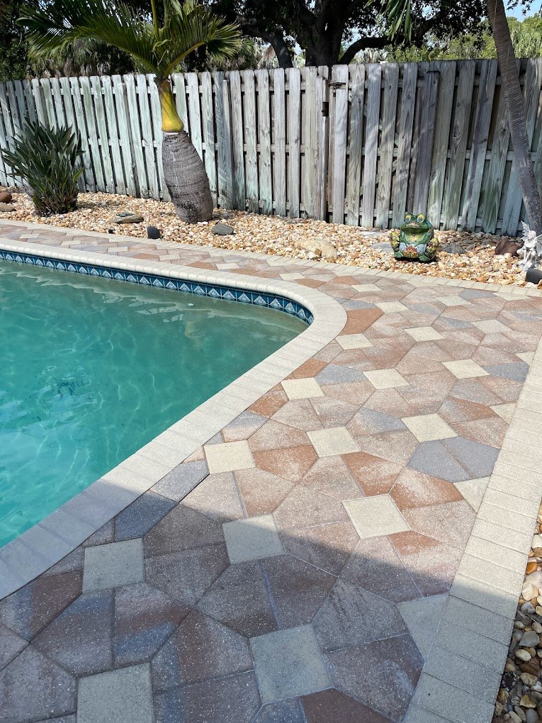 Freshly sealed poolside pavers in Volusia County showing enhanced color and protection after professional paver sealing by Suncoast Softwash.
