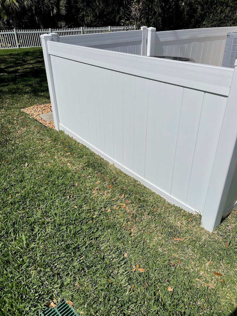 Clean white vinyl fence after professional fence cleaning by Suncoast Softwash in Brevard County, FL