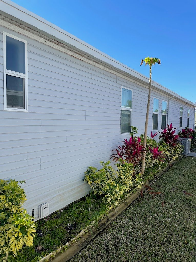 Freshly cleaned siding after professional house washing in Brevard and Volusia County by Suncoast Softwash.